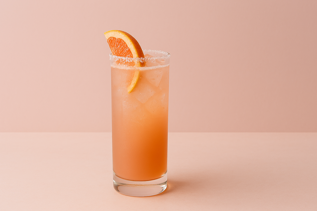 Paloma mocktail with a slice of grapefruit and a salted glass rim. One of DASH Water's easy spring mocktail recipes.