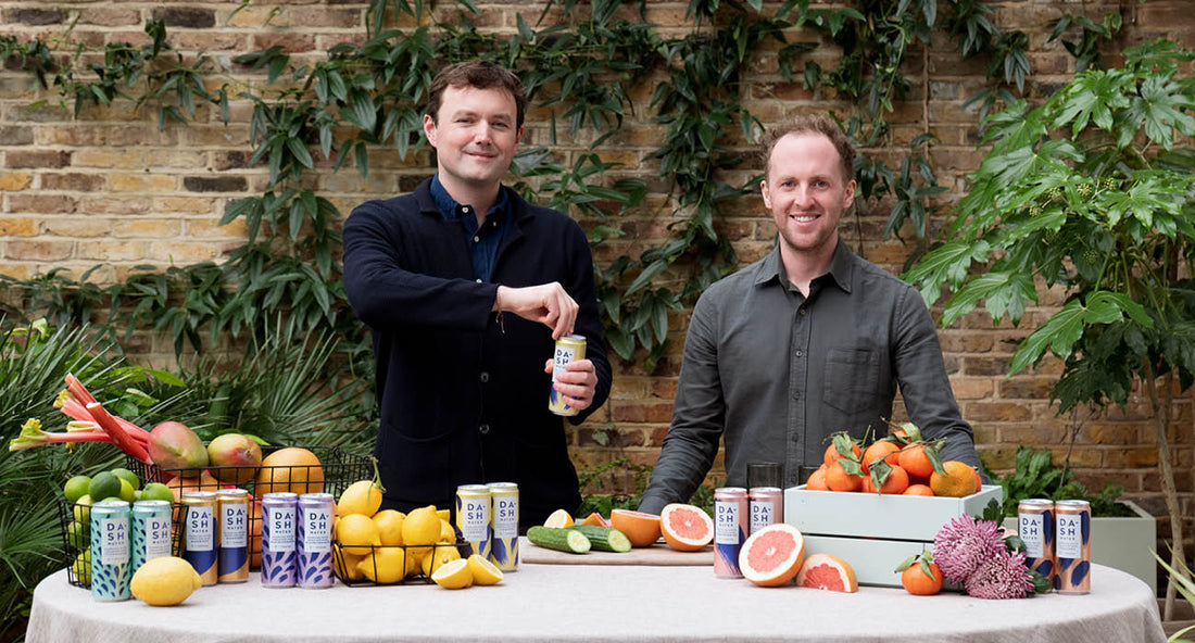 Alex Wright and Jack Scott, co-founders of DASH Water, photographed with DASH healthy soft drinks and wonky fruit ingredients.