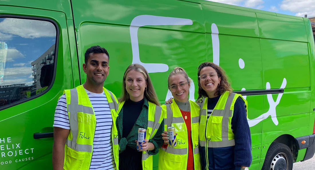 Four volunteers next to van