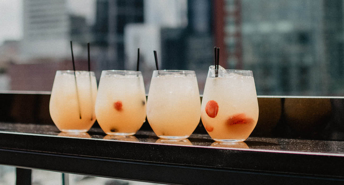 Four glasses of white sangria mocktails